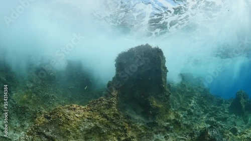 Wallpaper Mural sun rays sun beam sun shine underwater fish around waves on rocks white foam slow motion
 Torontodigital.ca