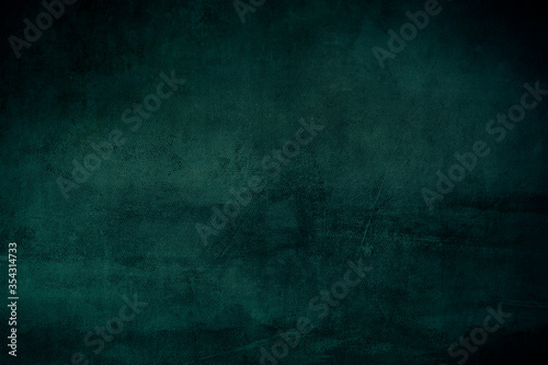 Dark green grungy backdrop or texture