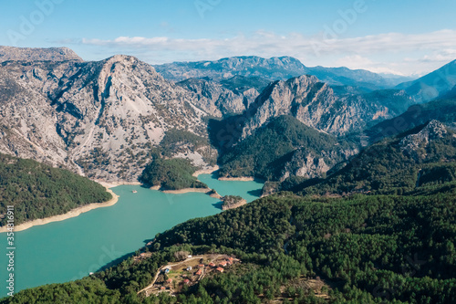 Water reservoir landscape with mountains, blue sky, vegetation. Manavgat, Antalya, Turkey. Vacation holiday recreation, travel concept.
