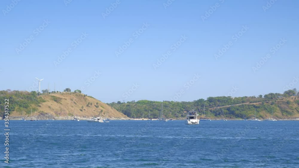 Panorama of a bay with boats and yachts are floating in blue waves in hot sunny day Panorama of a bay with boats and yachts are floating in blue waves in hot sunny day
