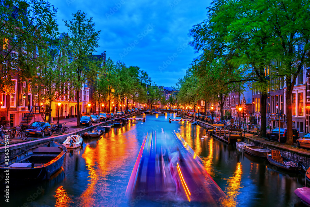 City Lights In Amsterdam Canal At Dusk In Holland, Netherlands