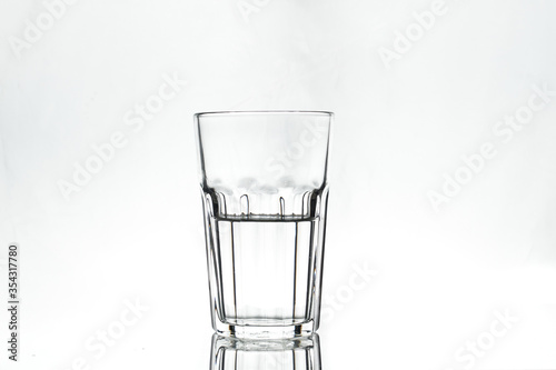 Wallpaper Mural Half full glass on white background. Isolated. Backlight. Torontodigital.ca