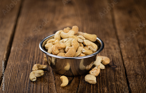 Some roasted Cashew Nuts (close up; selective focus)