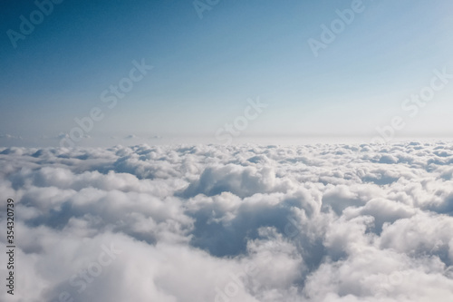 Clouds top view. Heavenly landscape. Over the Clouds. Fantastic background with clouds