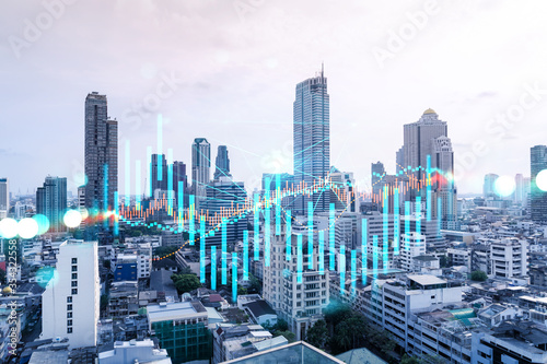 Forex and stock market chart hologram over panorama city view of Bangkok, the financial center in Asia. The concept of international trading. Double exposure. © VideoFlow