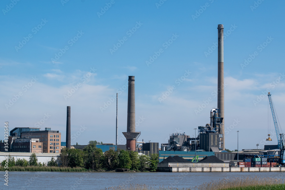 Heavy industry in the port of Antwerp in the rive Scheldt. Belgium