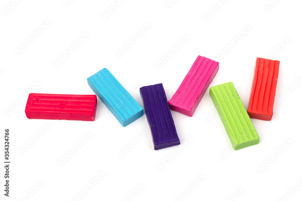 Сolorful plasticine isolated on white background. Space for text Сolorful plasticine isolated on white background. Space for text
