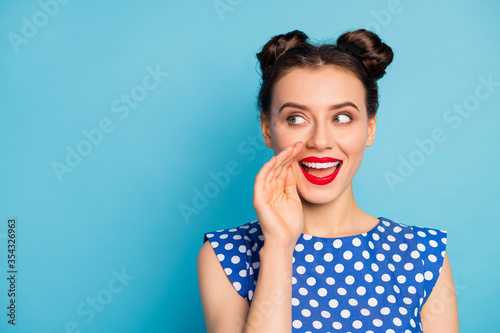 Close up photo of funny lady chatterbox hold arm mouth yelling secret information crowd people bad cunning person wear dotted white blouse isolated blue color background photo