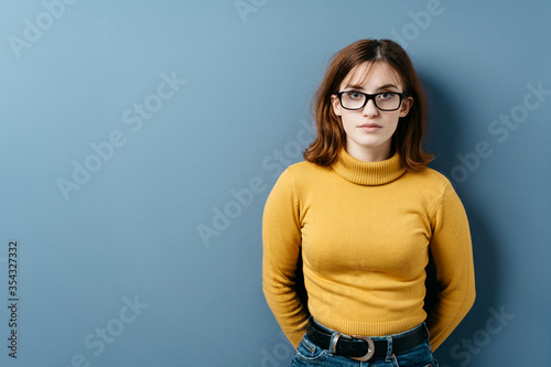 Photography Serious intense young woman wearing eyeglasses
