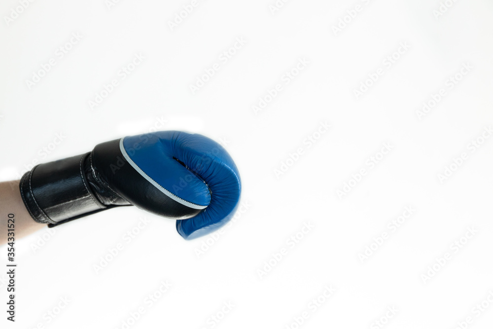 hand in a blue Boxing glove on a white background hand in a blue Boxing glove on a white background