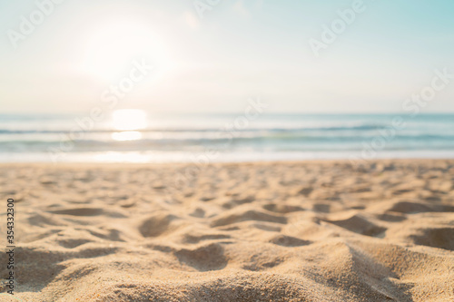Fototapeta Naklejka Na Ścianę i Meble -  Tropical beach with smooth wave and sunset sky abstract background.