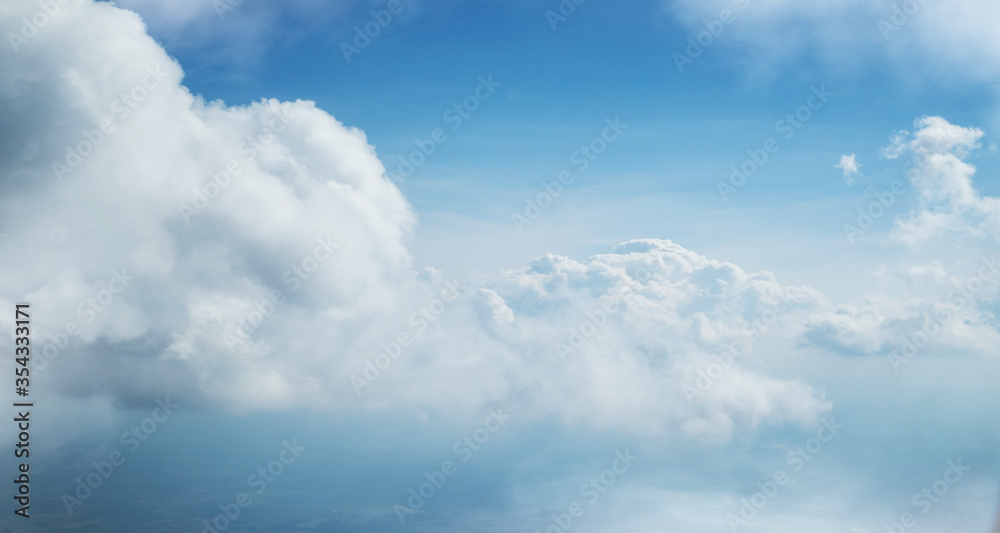 Dramatic blue sky background with white clouds