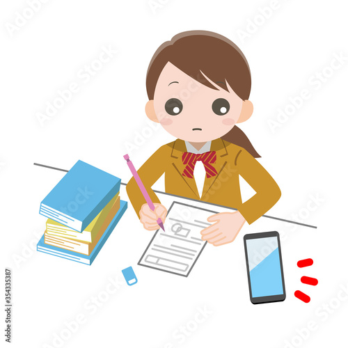 机に向かって勉強している女の子がスマホを気にしている_線なし