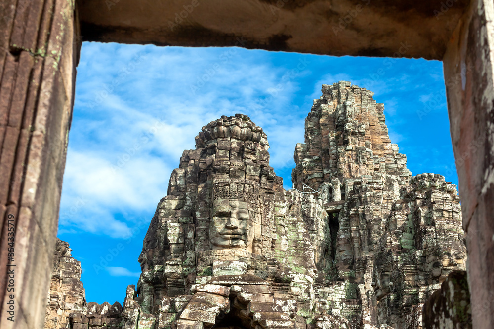Ancient stone faces of Bayon temple  Angkor Cambodia
