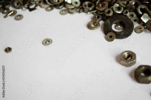 nuts for bolts on a white background © Евгения Соломенная