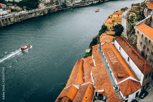 top view of the river, warehouses and floating ships in the old city