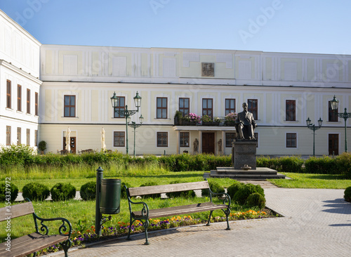 Frystat chateau in Karvina, Silesia, Czech Republic / Czechia - White chateau made in Empire style. Statue of Tomas Garrigue Masaryk in park and garden. Sunny summer. photo