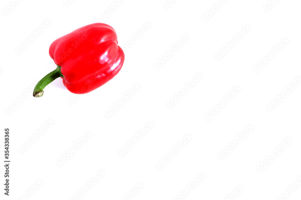 Red sweet pepper on a white background. Suitable for mockups and backgrounds. Cooking. Vegetables.