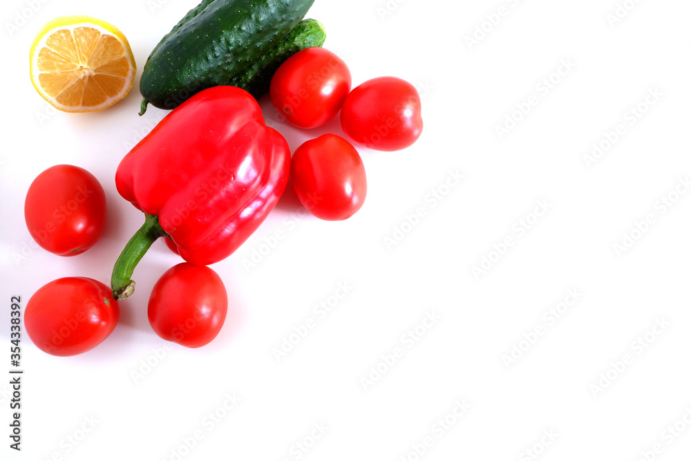 Cucumbers, tomatoes and sweet red peppers on a white background. Suitable for mockups and backgrounds. Cooking. Vegetables. Cucumbers, tomatoes and sweet red peppers on a white background. Suitable for mockups and backgrounds. Cooking. Vegetables.