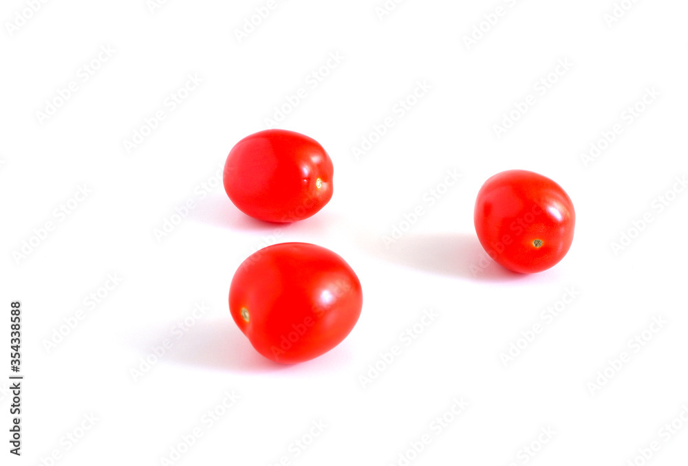 Red tomatoes on a white background. Suitable for mockups and backgrounds. Cooking. Vegetables. Red tomatoes on a white background. Suitable for mockups and backgrounds. Cooking. Vegetables.