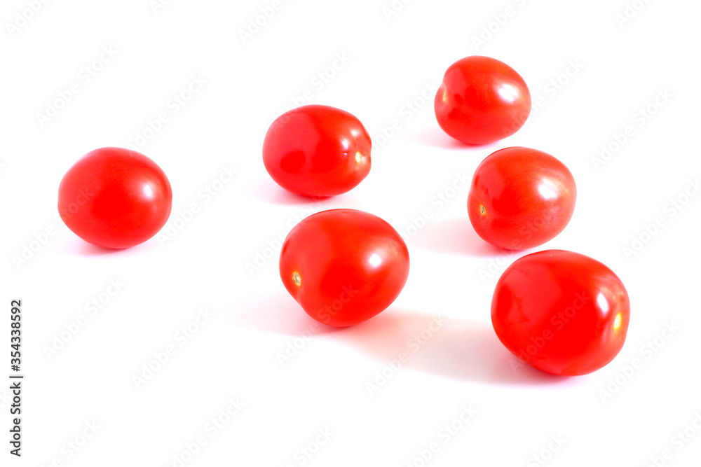 Red tomatoes on a white background. Suitable for mockups and backgrounds. Cooking. Vegetables. Red tomatoes on a white background. Suitable for mockups and backgrounds. Cooking. Vegetables.