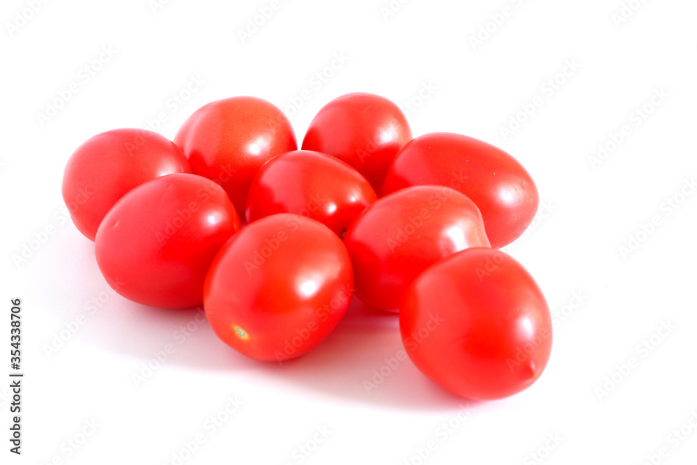 Red tomatoes on a white background. Suitable for mockups and backgrounds. Cooking. Vegetables. Red tomatoes on a white background. Suitable for mockups and backgrounds. Cooking. Vegetables.