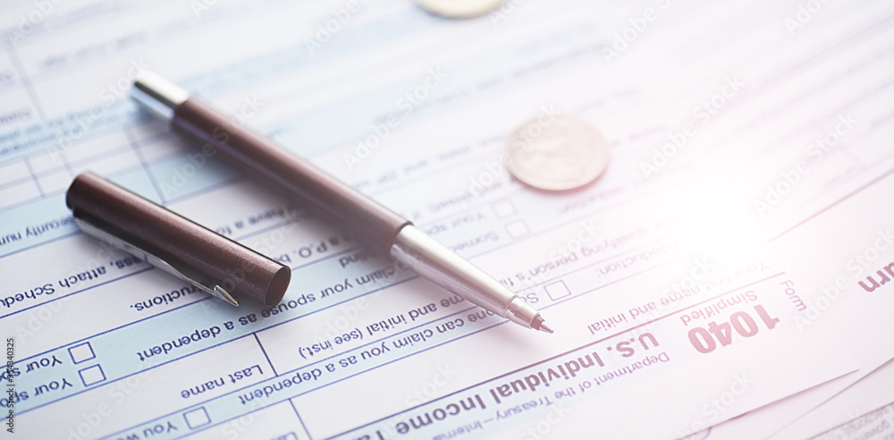 Annual tax reporting. Tax form on the table. Financial statements for signature. Annual tax reporting. Tax form on the table. Financial statements for signature.