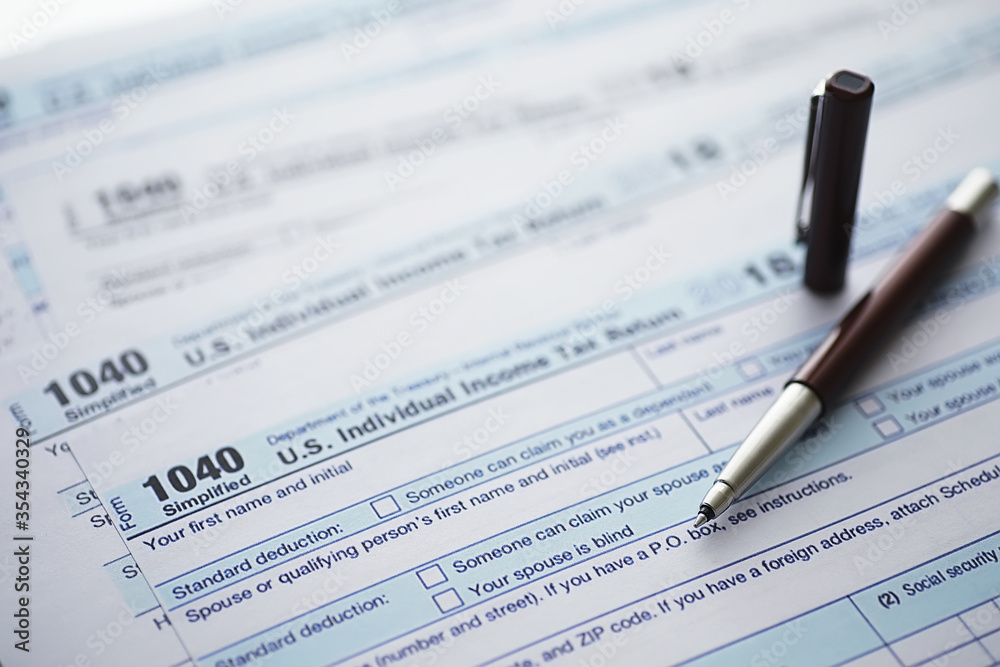 Annual tax reporting. Tax form on the table. Financial statements for signature. Annual tax reporting. Tax form on the table. Financial statements for signature.
