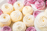 Close up of colorful meringues. Homemade marshmallows with different colors, pink and white