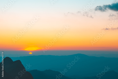 Sunset or evening time with half of sun with clouds at Doi Luang Chiang Dao, Chaingmai, Thailand. Asia.