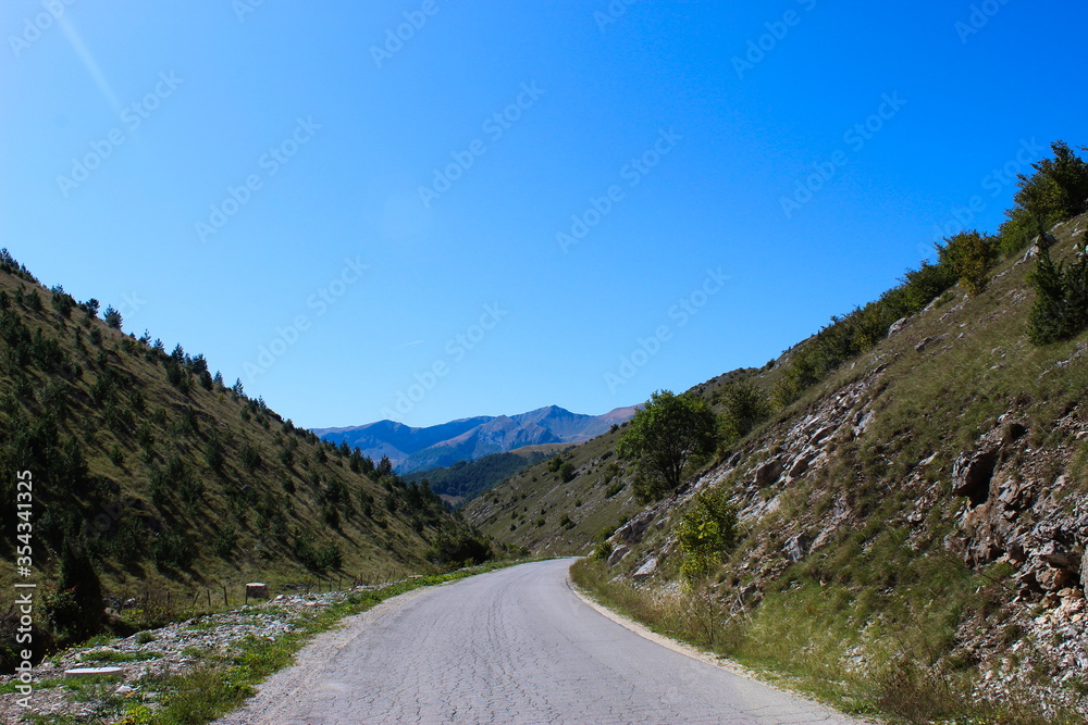 The road to the mountains. Mountains in the background. The road to the mountain Bjelasnica in Bosnia and Herzegovina.