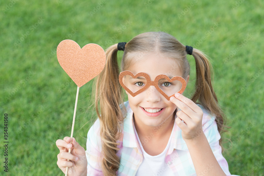 Love these fun Valentine props. Valentines girl hold photo booth props. Party look of happy child. Valentines day party. Fashion accessories for Valentines day. Fashion and beauty. Valentines day Love these fun Valentine props. Valentines girl hold photo booth props. Party look of happy child. Valentines day party. Fashion accessories for Valentines day. Fashion and beauty. Valentines day