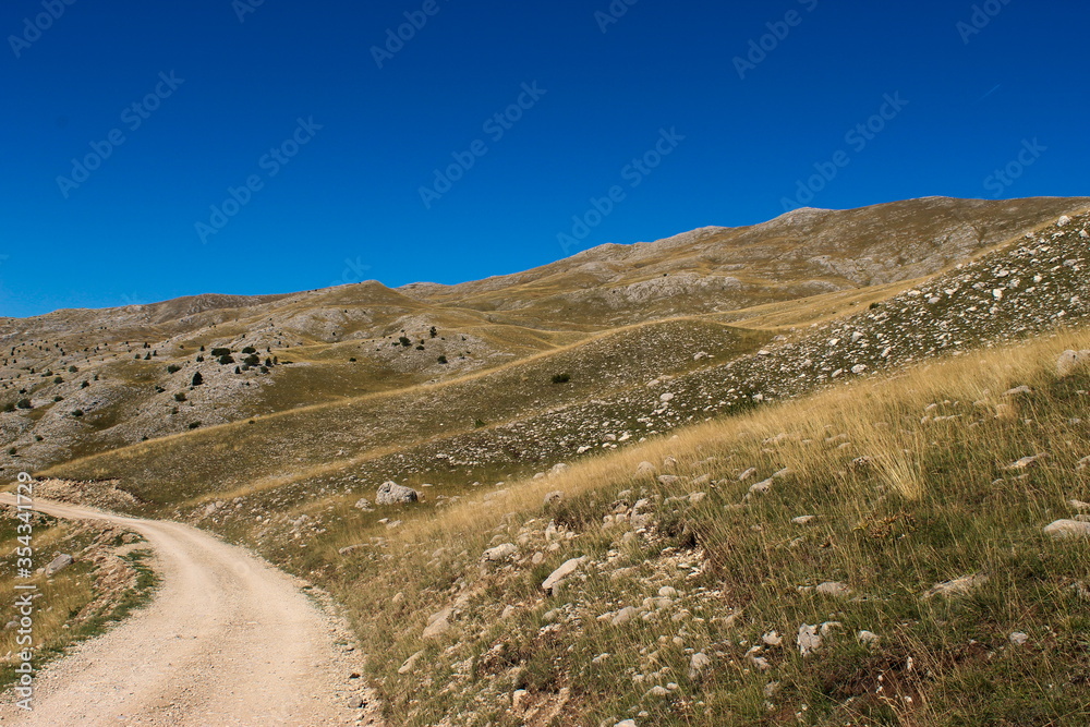 Mountain road on the mountain Bjelasnica, rocky landscape in autumn. Bjelasnica Mountain, Bosnia and Herzegovina.