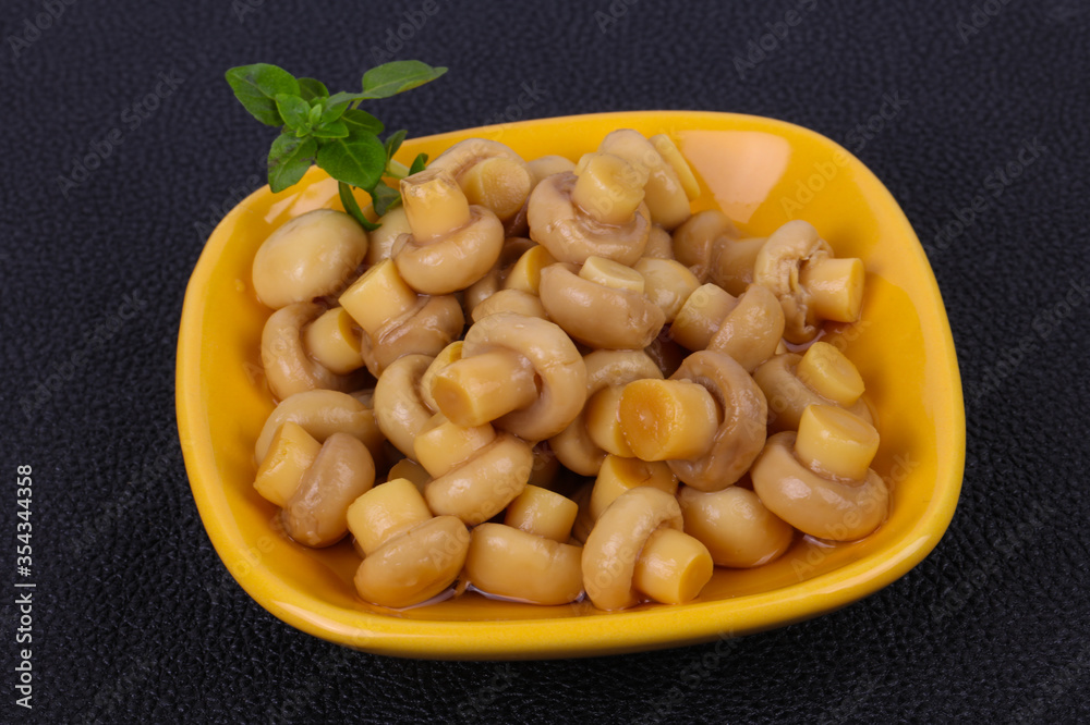 Pickled champignon heap in the bowl Pickled champignon heap in the bowl