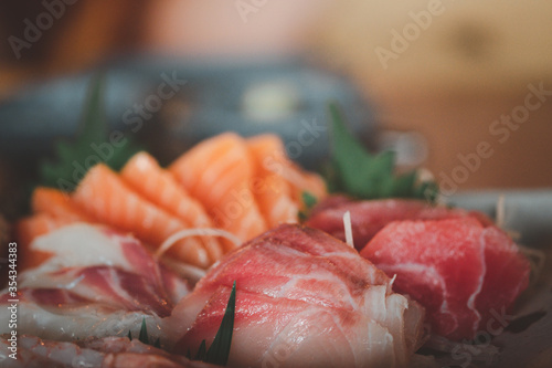 Mixed slices of fresh raw salmon sashimi for dinner.