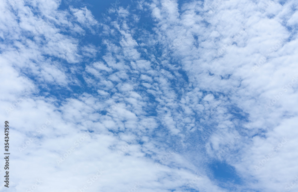 unlight blue vivid sky with white clouds,nature background unlight blue vivid sky with white clouds,nature background