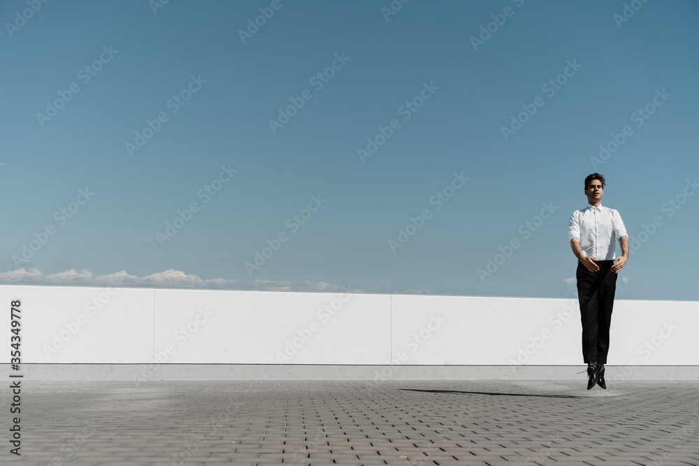 Ballet dancer practising on roof terrace Ballet dancer practising on roof terrace