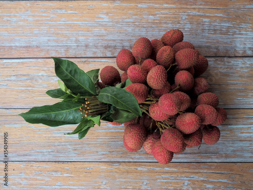 Lychee on wooden background for sale in local market.background, farmer fruit market.