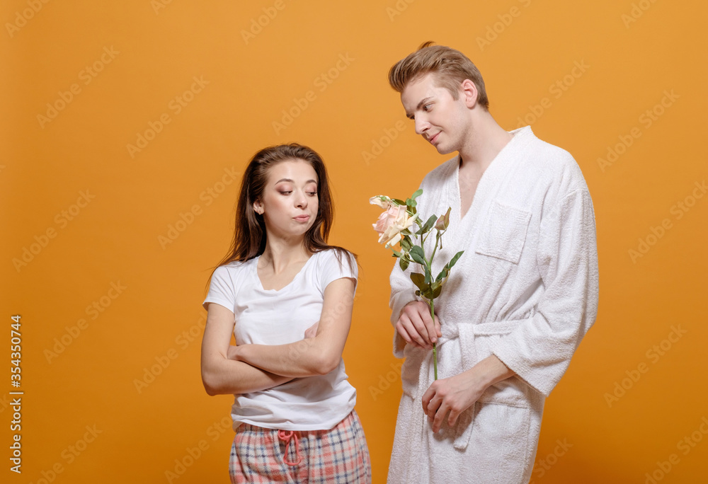 man and woman reconciliation, man gives flowers to woman man and woman reconciliation, man gives flowers to woman