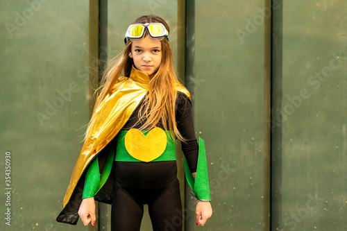Girl posing in super heroine costume