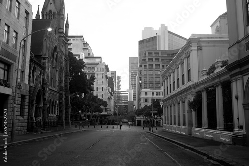 historic church with buildings at empty greenmarket square during cape town in lockdown