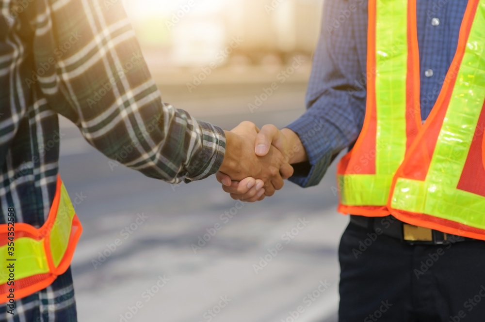 Teamwork Engineer shake hand agreement deal project construction success,Technician support partner cooperate team service contractor work building construction. Teamwork Engineer shake hand agreement deal project construction success,Technician support partner cooperate team service contractor work building construction.