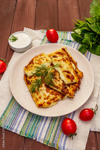 Hot appetizer - pita bread with cheese and herbs. Vegetarian healthy food