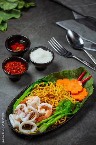 Noodles topped with seafood noodles, crispy noodles, Thai food