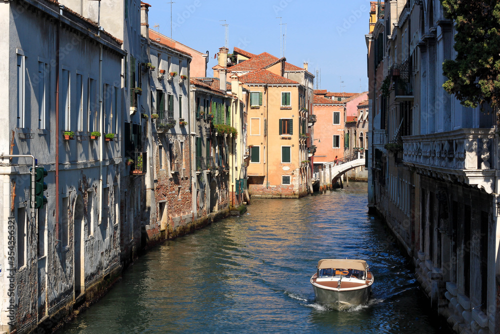 canal in Venice with bridge and narrow way