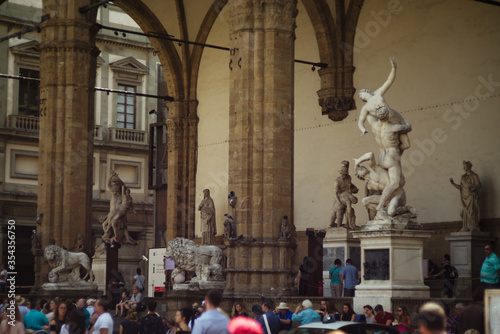 Florence, Italy - August 20, 2018. People in Piazza Signoria in Florence. Sculpture in Piazza Signoria in Florence.