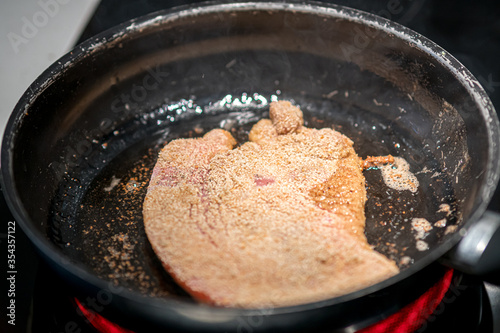 Deep fry sliced meat, cook breaded cutlet or cotoletta