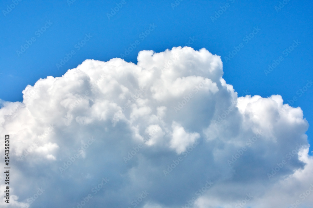 spring cloudy sky, cumulus clouds in the blue sky in anticipation of the rain spring cloudy sky, cumulus clouds in the blue sky in anticipation of the rain