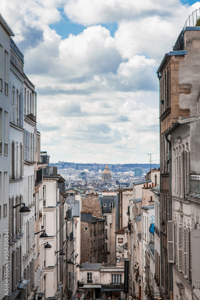 Obraz premium View of old district of Paris city with old skyscrapers above, France