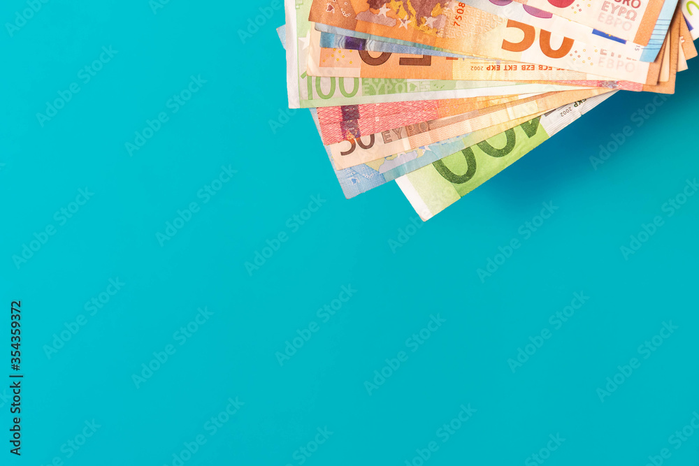Euro banknotes isolated on blue background Euro banknotes isolated on blue background